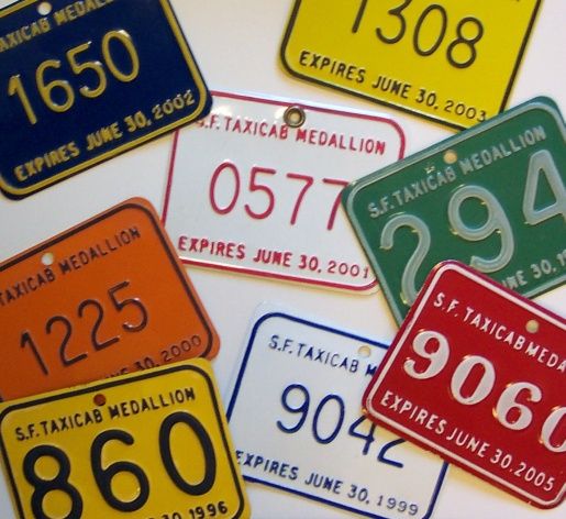 Red, orange, yellow, green, blue and white are the colors of San Francisco taxi medallions issued in various years
